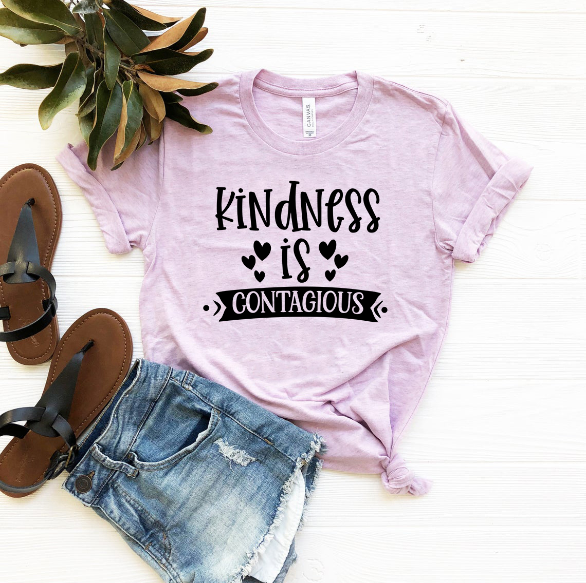 A unisex Kindness Is Contagious Shirt in various colors, showcasing its soft fabric and stylish design.