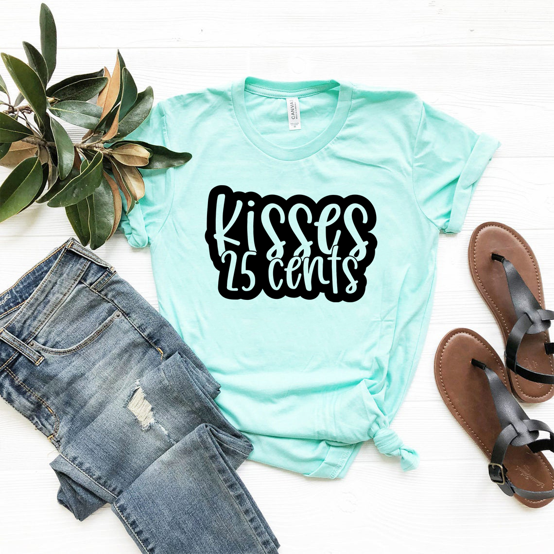 Kisses 25cent Shirt displayed in various colors, showcasing its soft fabric and stylish design.