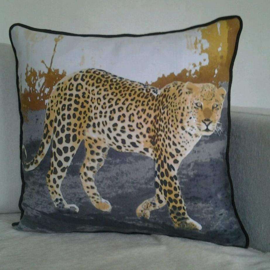 A stylish leopard print decorative throw cushion cover showcasing a unique design, perfect for home decor.