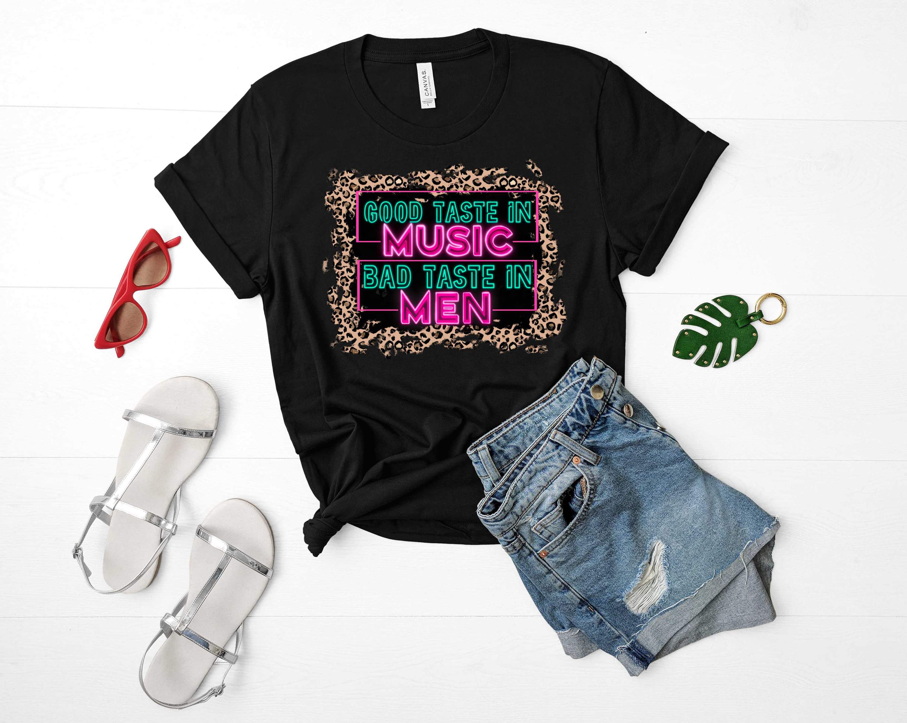 Leopard Good Taste in Music Graphic Tee featuring a bold leopard print and stylish text, perfect for music lovers.