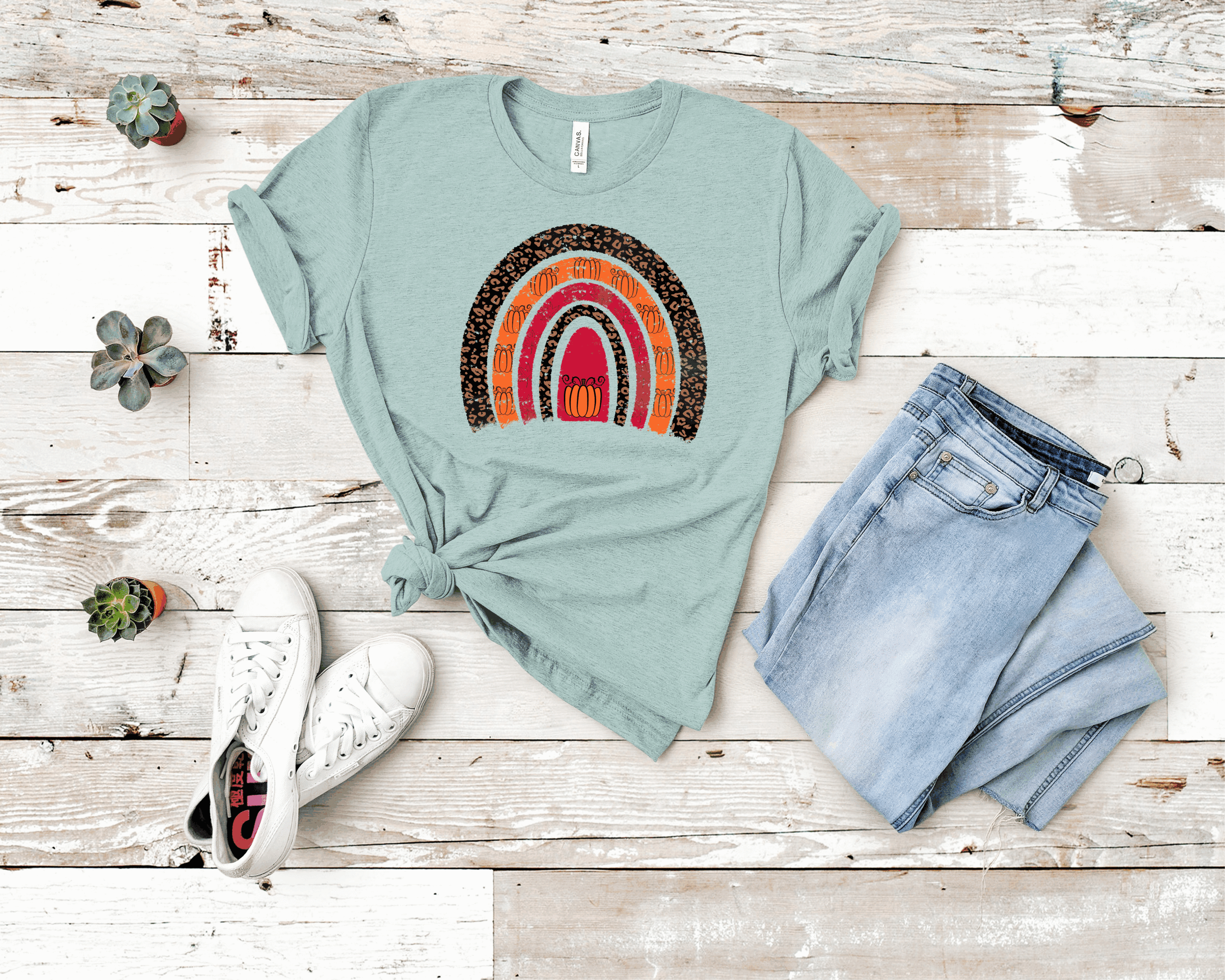 Leopard Pumpkin Rainbow graphic tee featuring a vibrant design on a soft Bella Canvas fabric.