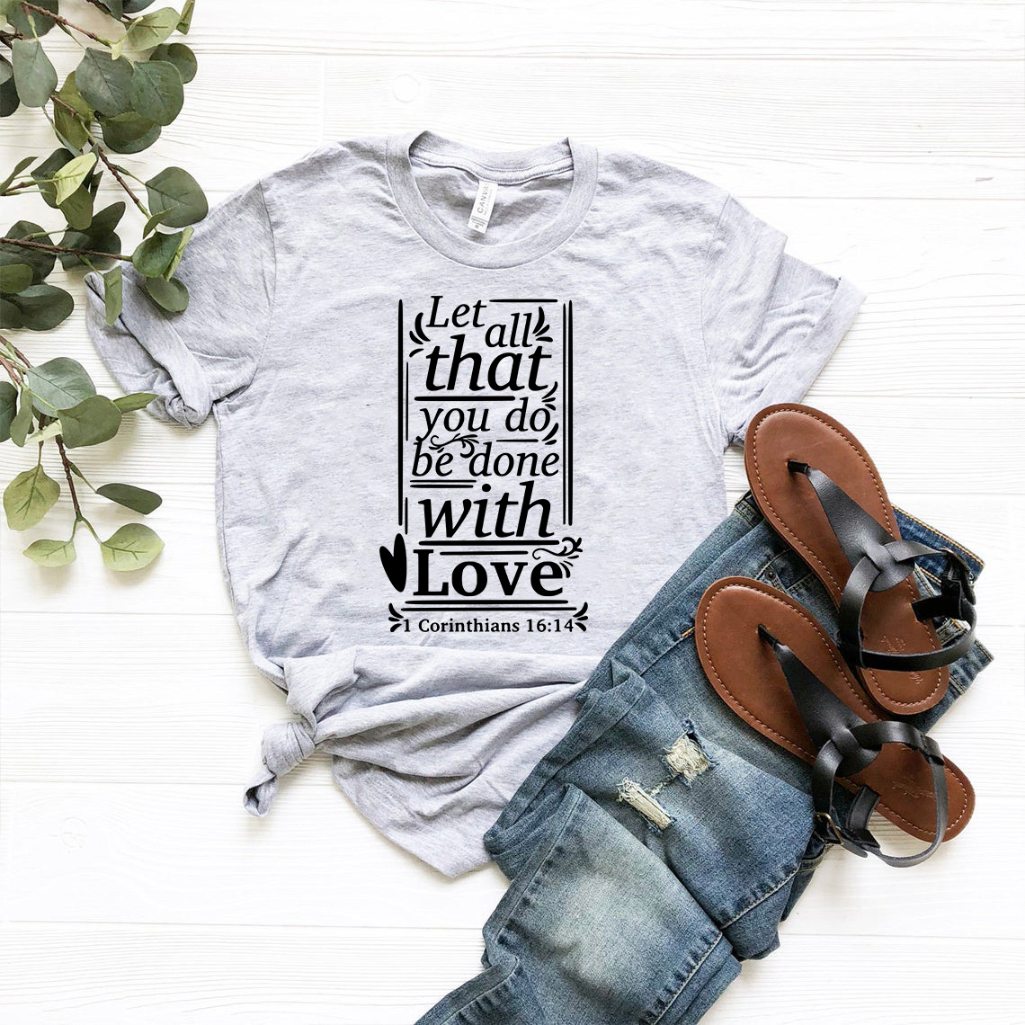 Unisex T-shirt featuring the phrase 'Let All That You Do Be Done With Love' in a stylish design, available in multiple colors.