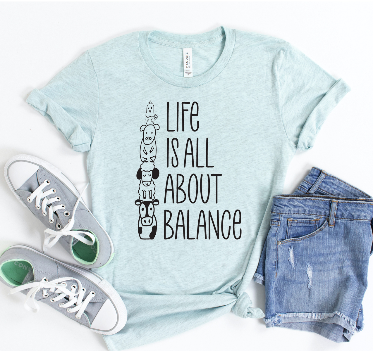 Life Is All About Balance T-shirt in various sizes, showcasing its soft fabric and unisex design.