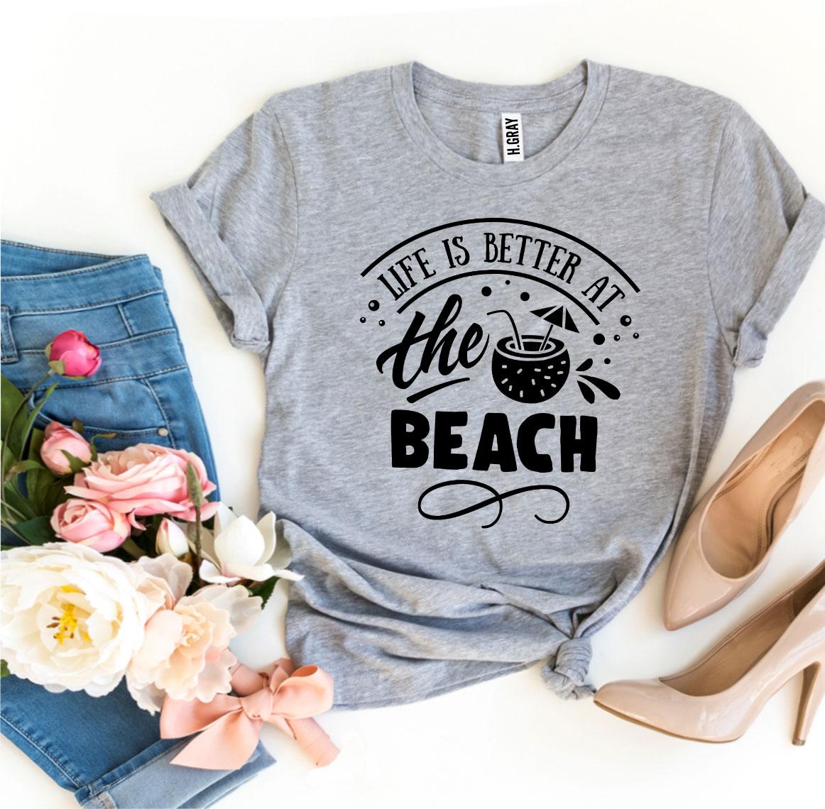 A stylish 'Life Is Better At The Beach' T-shirt made from premium ring spun cotton, featuring a vibrant flex print design.