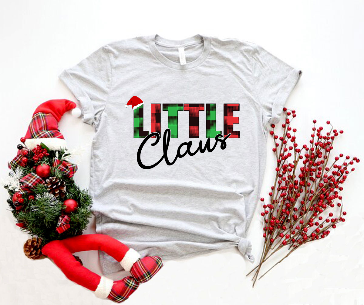 A stylish unisex Little Claus Shirt made from soft ring spun cotton, available in various colors and sizes, featuring a classic crew neck and short sleeves.