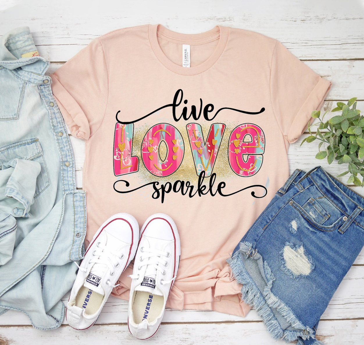 Live Love Sparkle T-shirt in various sizes, showcasing its soft fabric and unisex design.