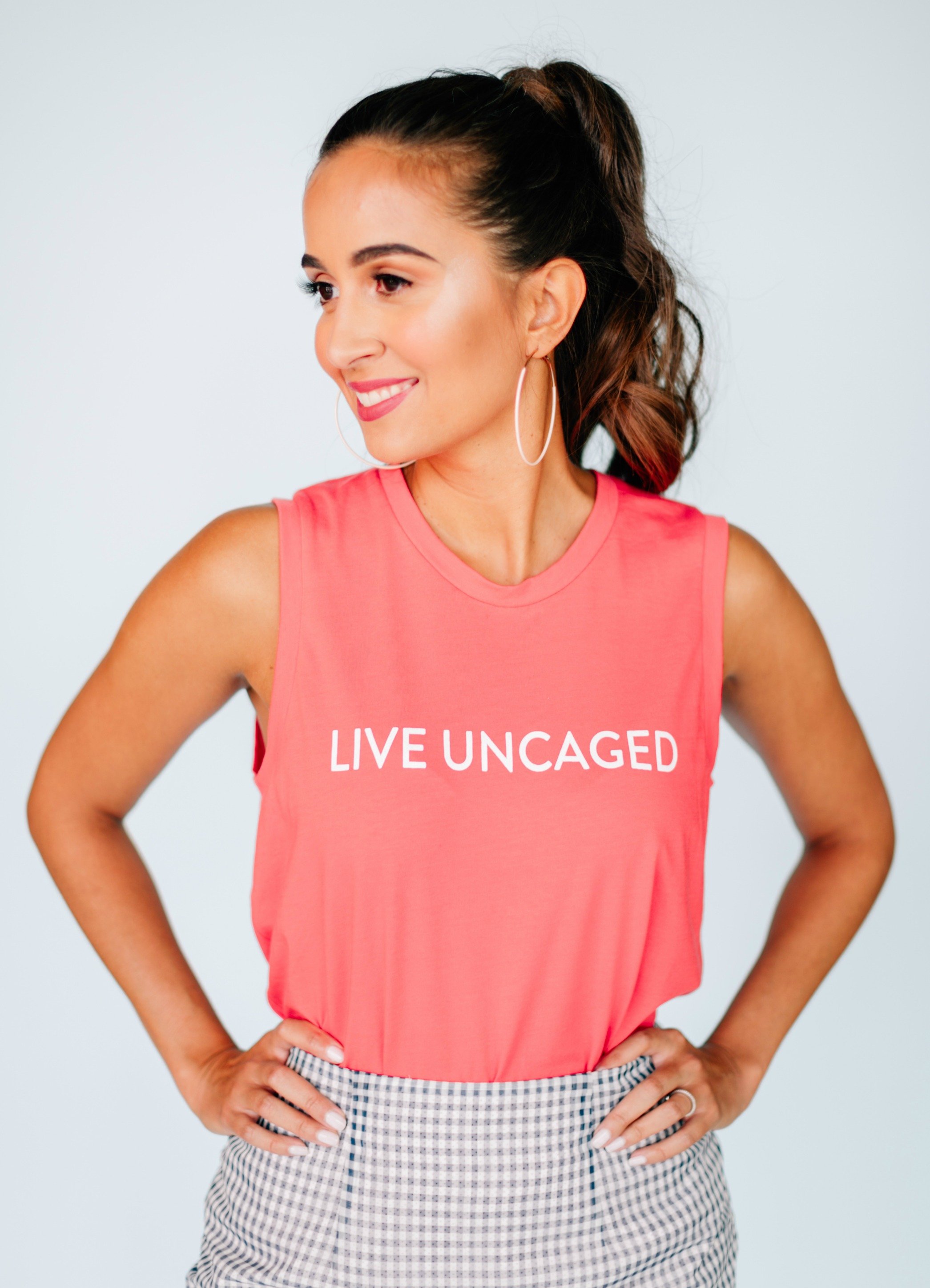 LIVE UNCAGED Tank in Spiced Coral, showcasing its relaxed fit and soft fabric, perfect for casual or office wear.