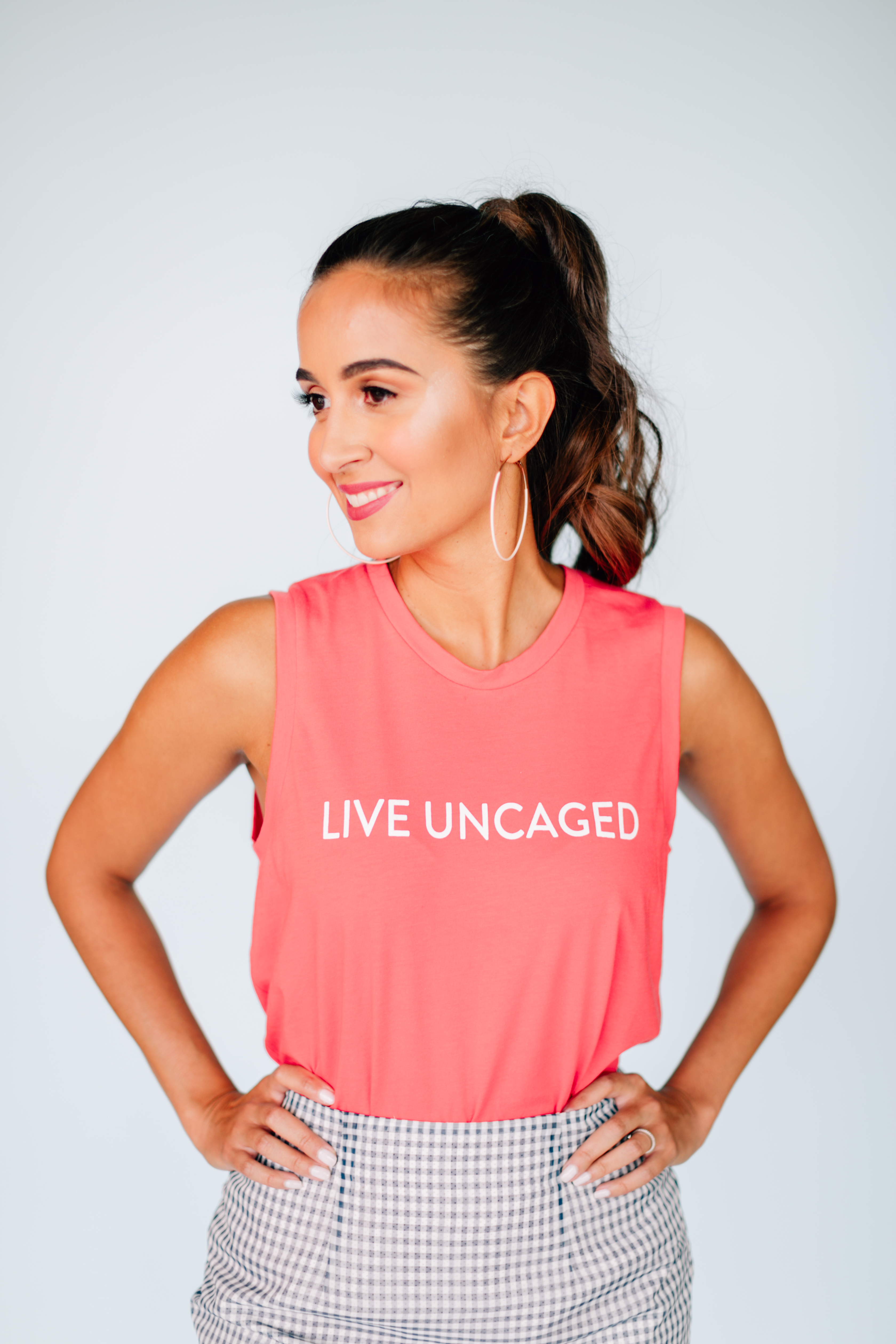 LIVE UNCAGED Tank in Spiced Coral, showcasing its relaxed fit and soft fabric, perfect for casual or office wear.