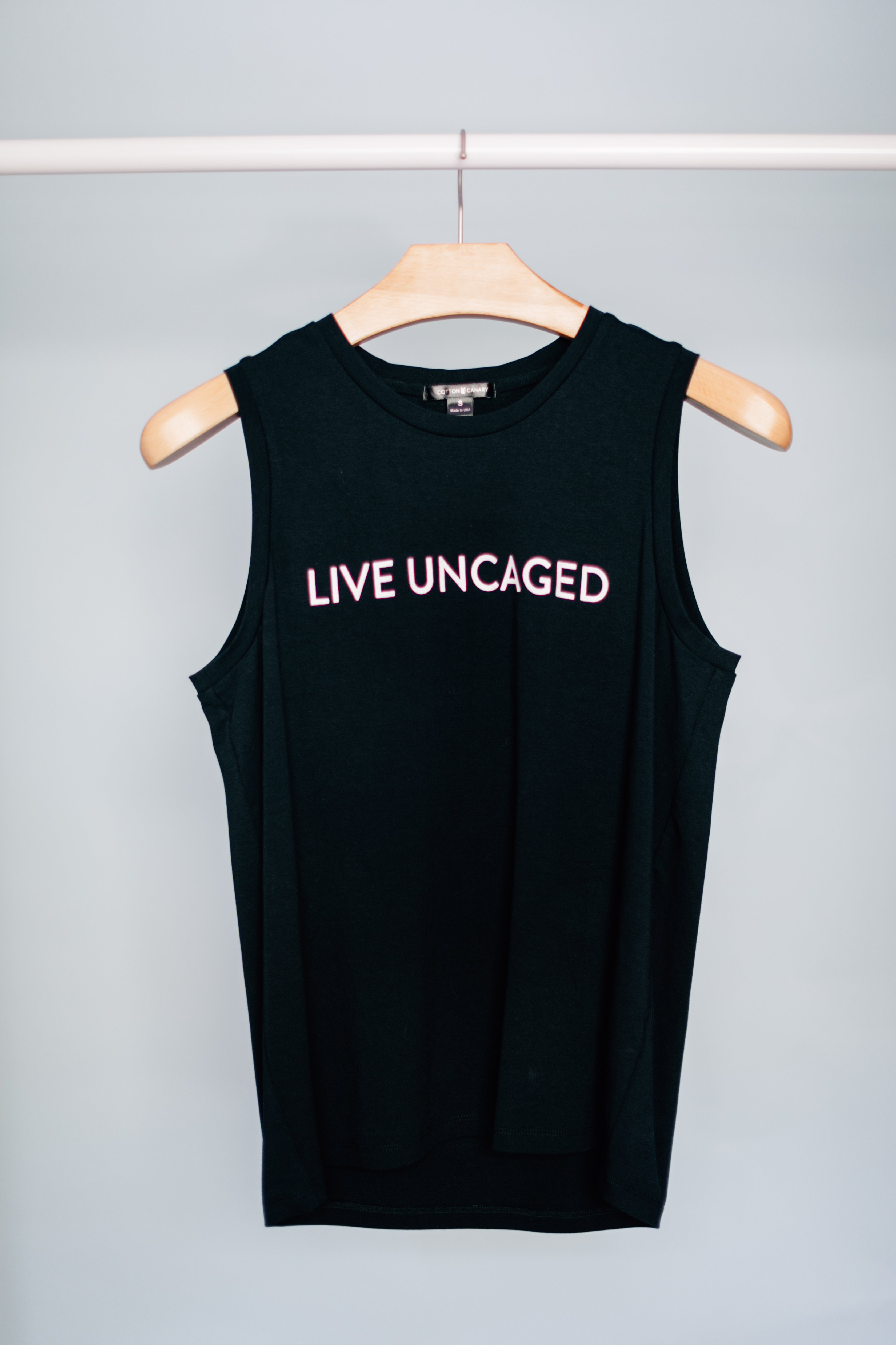 LIVE UNCAGED Tank in Spiced Coral, showcasing its relaxed fit and soft fabric, perfect for casual or office wear.