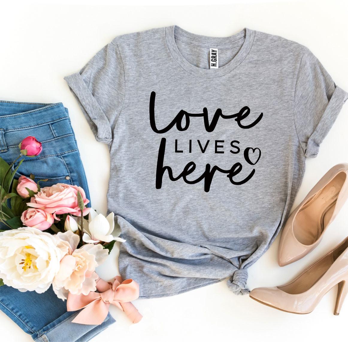 Love Lives Here T-shirt made from premium ring spun cotton, featuring a soft textile flex print design.