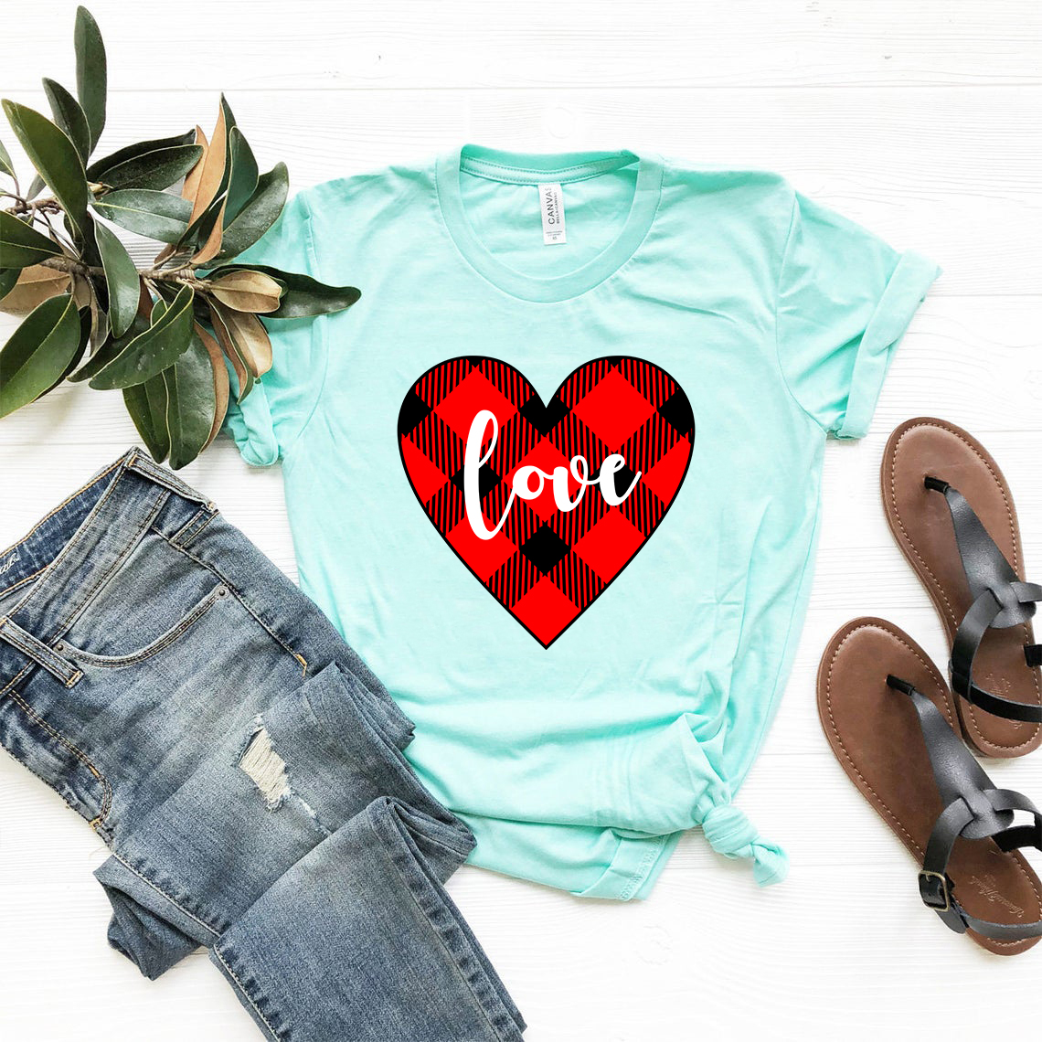 A stylish unisex Love Shirt made from soft ring spun cotton, available in various colors and sizes, featuring a classic crew neck and short sleeves.