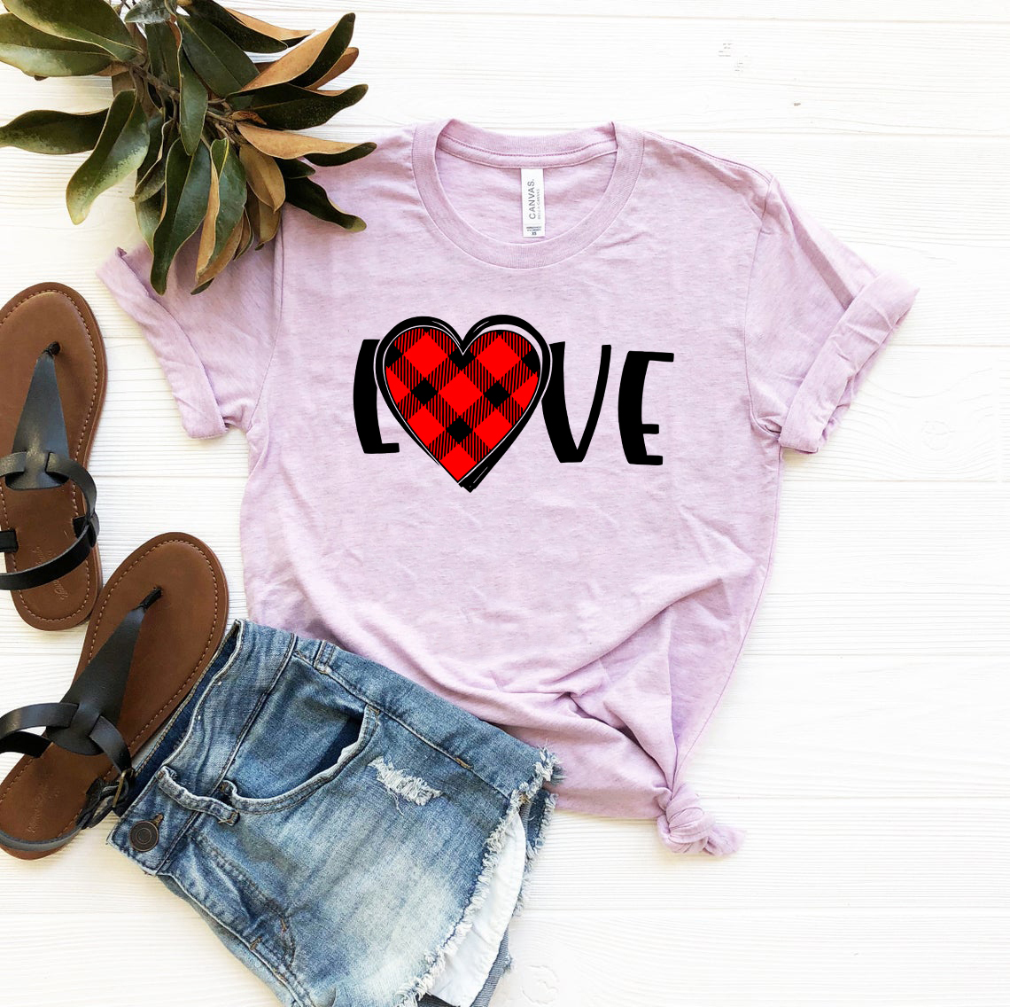 A stylish unisex Love Shirt made from soft ring spun cotton, available in various colors and sizes, featuring a crew neck and short sleeves.