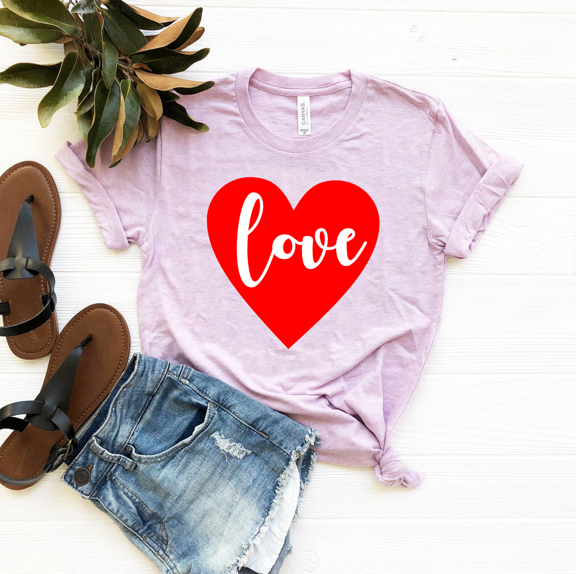 A stylish unisex Love Shirt made from soft ring spun cotton, available in various colors and sizes, featuring a classic crew neck and short sleeves.