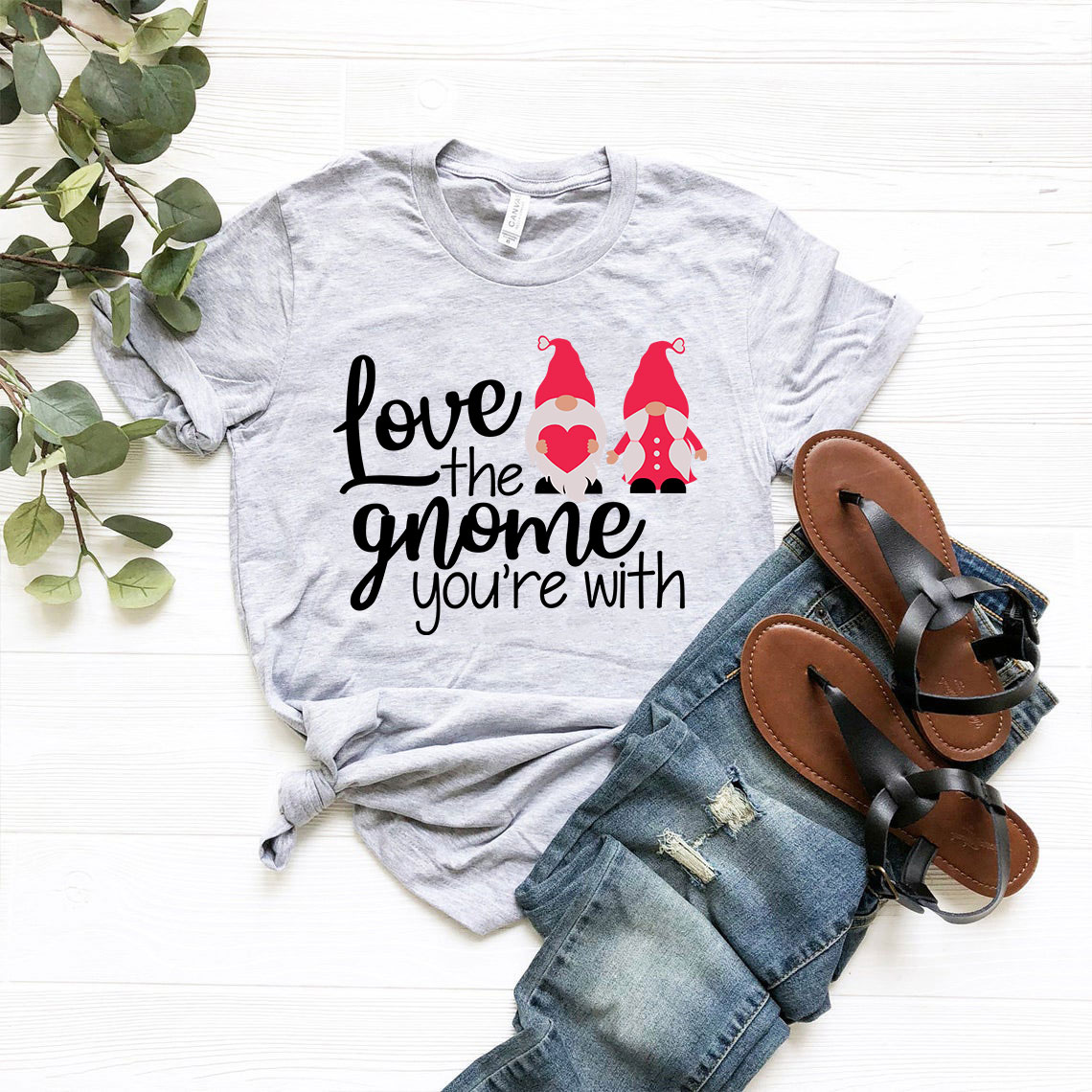 Unisex 'Love The Gnome You're With' T-shirt in various colors, showcasing its soft fabric and stylish design.