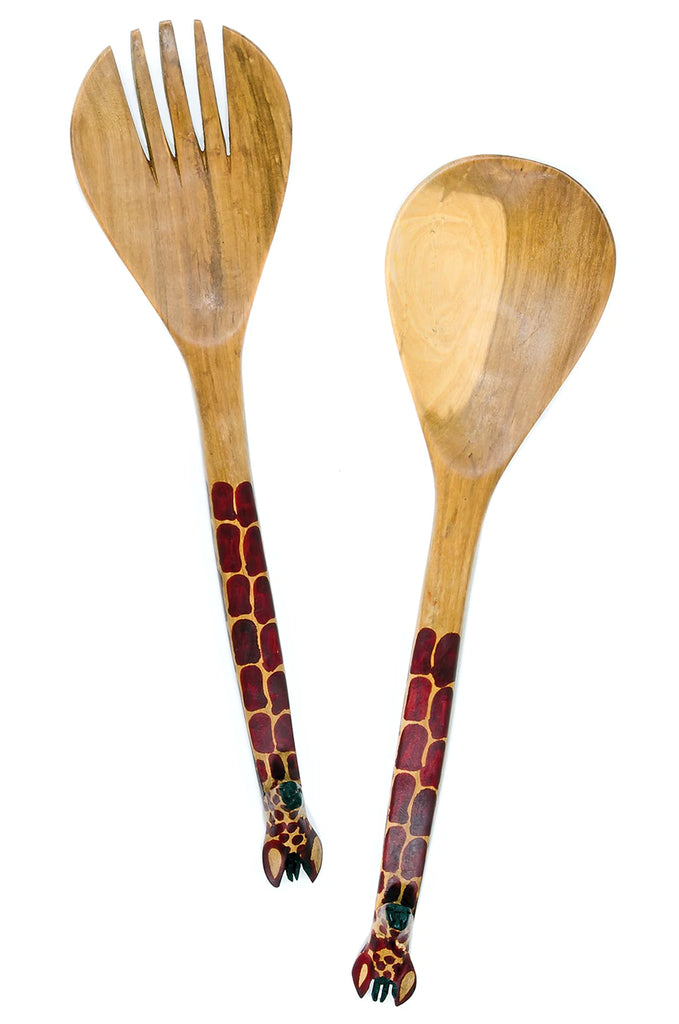 Hand-carved mahogany salad servers featuring whimsical giraffe handles, perfect for serving salads.