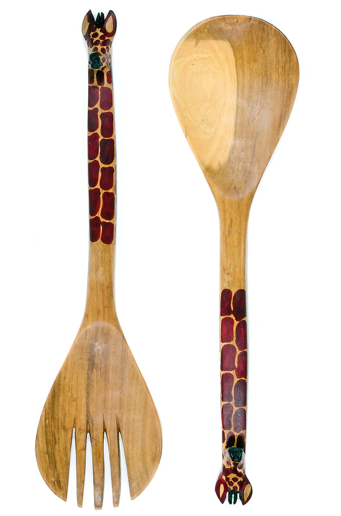 Hand-carved mahogany salad servers featuring whimsical giraffe handles, perfect for serving salads.