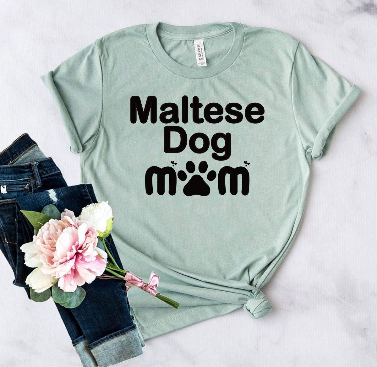 A stylish Maltese Dog Mom Shirt in various colors, showcasing a comfortable fit and high-quality print.