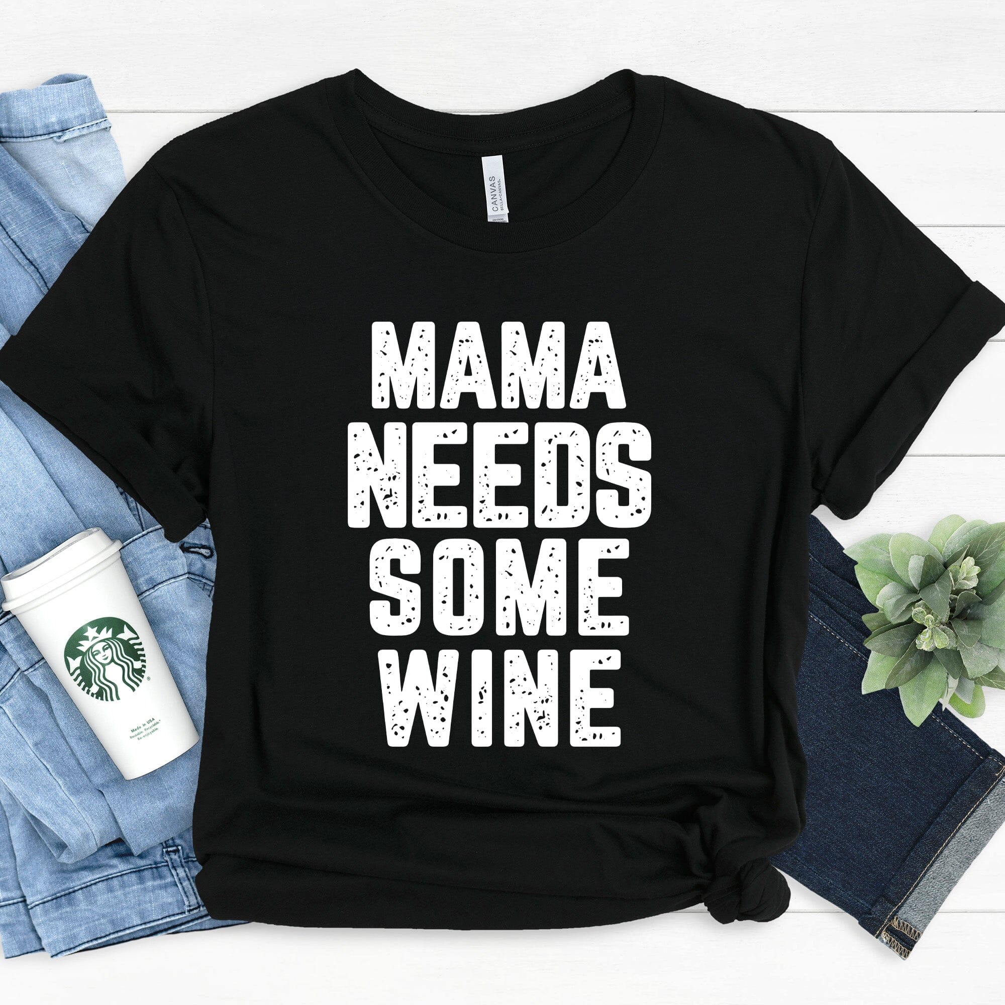 A stylish Mama Needs Some Wine Tee featuring a humorous design, made from soft Ringspun Cotton, perfect for casual wear.