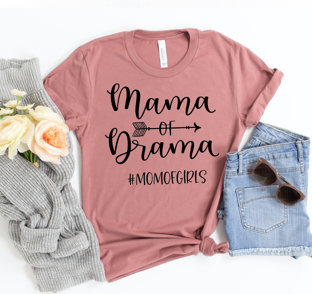 Mama Of Drama T-shirt displayed on a mannequin, showcasing its unisex design and soft fabric.