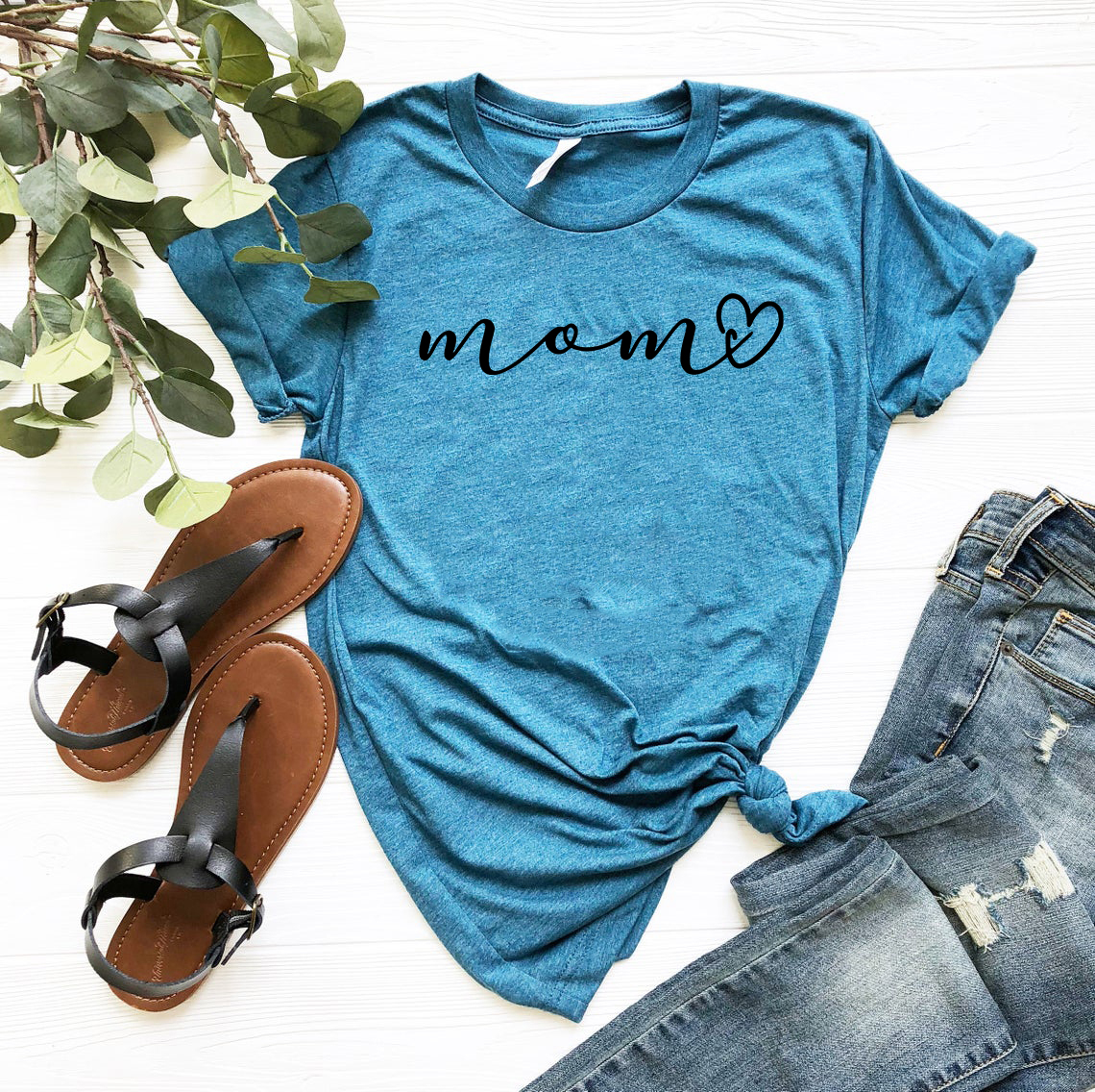 A stylish unisex Mama Shirt made from soft ring spun cotton, available in various colors and sizes, featuring a classic crew neck design.