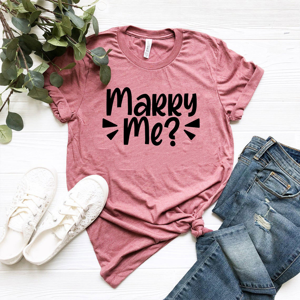 A stylish unisex Marry Me Shirt in various colors, showcasing its soft fabric and modern design.