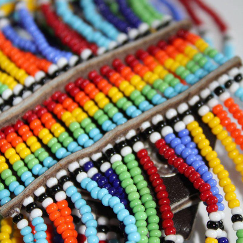 Colorful Maasai Beaded Cuff Bracelet showcasing intricate beadwork and flexible nylon threads, perfect for stylish arm adornment.