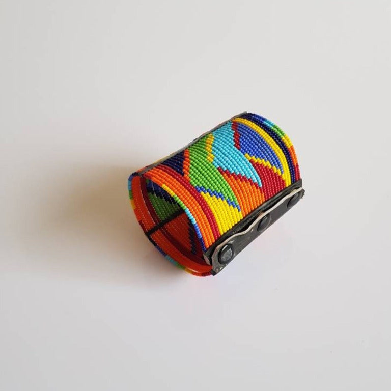 Handmade Maasai wrist bracelet featuring colorful beads and leather, showcasing traditional Kenyan craftsmanship.