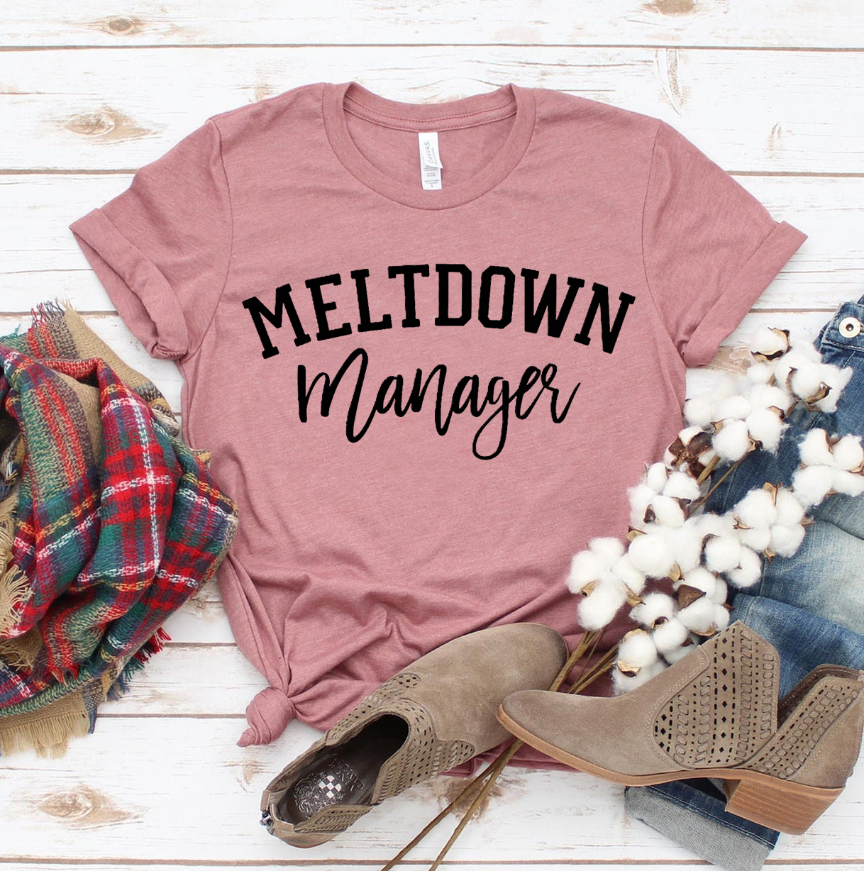 Meltdown Manager T-shirt made from premium ring spun cotton, featuring a soft textile flex print design in various sizes.