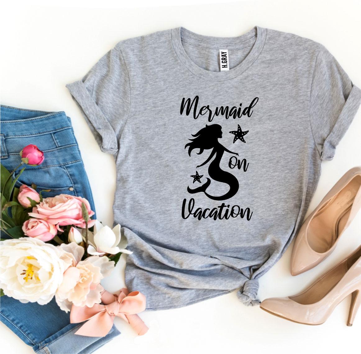 A stylish Mermaid On Vacation T-shirt made from premium ring spun cotton, featuring a vibrant design perfect for summer outings.