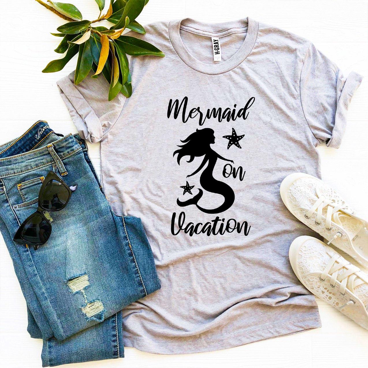 A stylish Mermaid On Vacation T-shirt made from premium ring spun cotton, featuring a vibrant design perfect for summer outings.