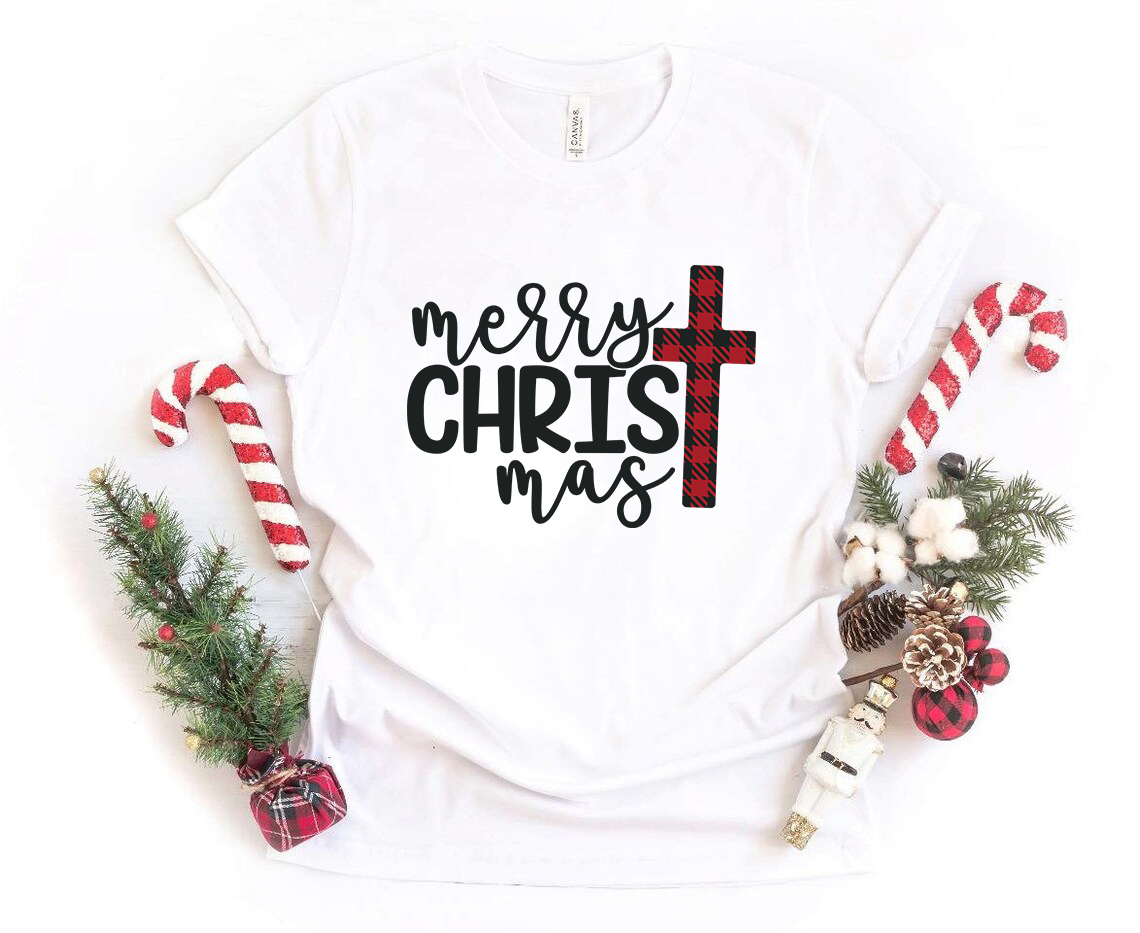 Merry Christmas Cross Shirt in various colors, showcasing its soft fabric and unisex design.