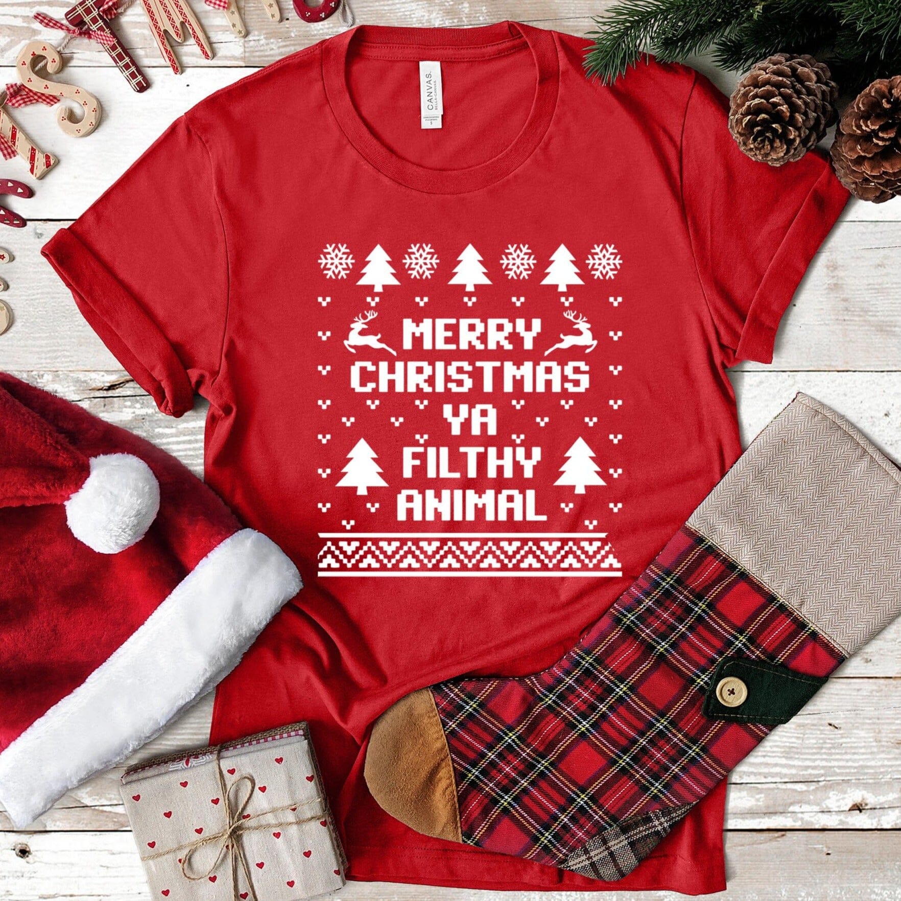 Merry Christmas Ya Filthy Animal Tee featuring a playful holiday design in a comfortable fit, perfect for festive celebrations.