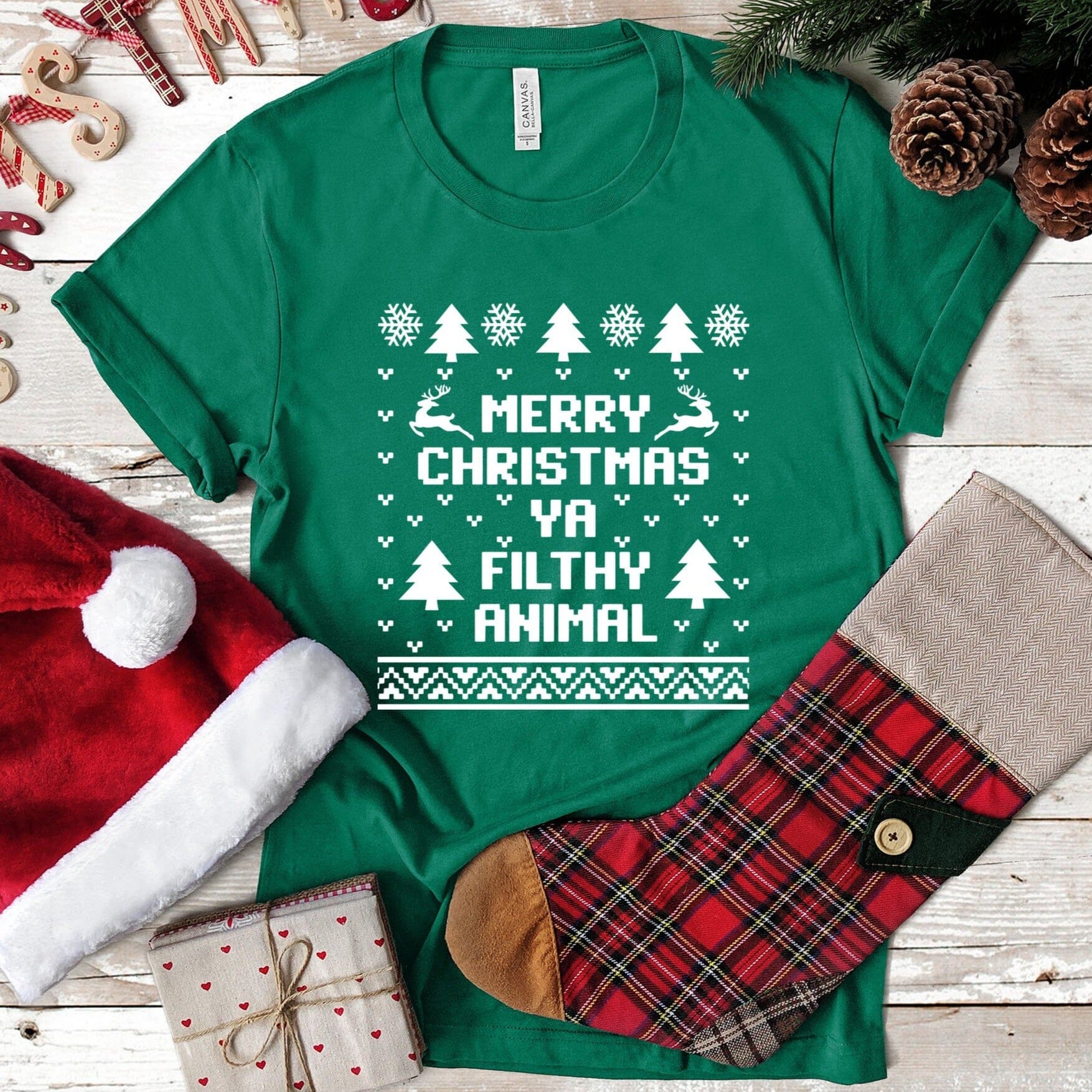 Merry Christmas Ya Filthy Animal Tee featuring a playful holiday design in a comfortable fit, perfect for festive celebrations.