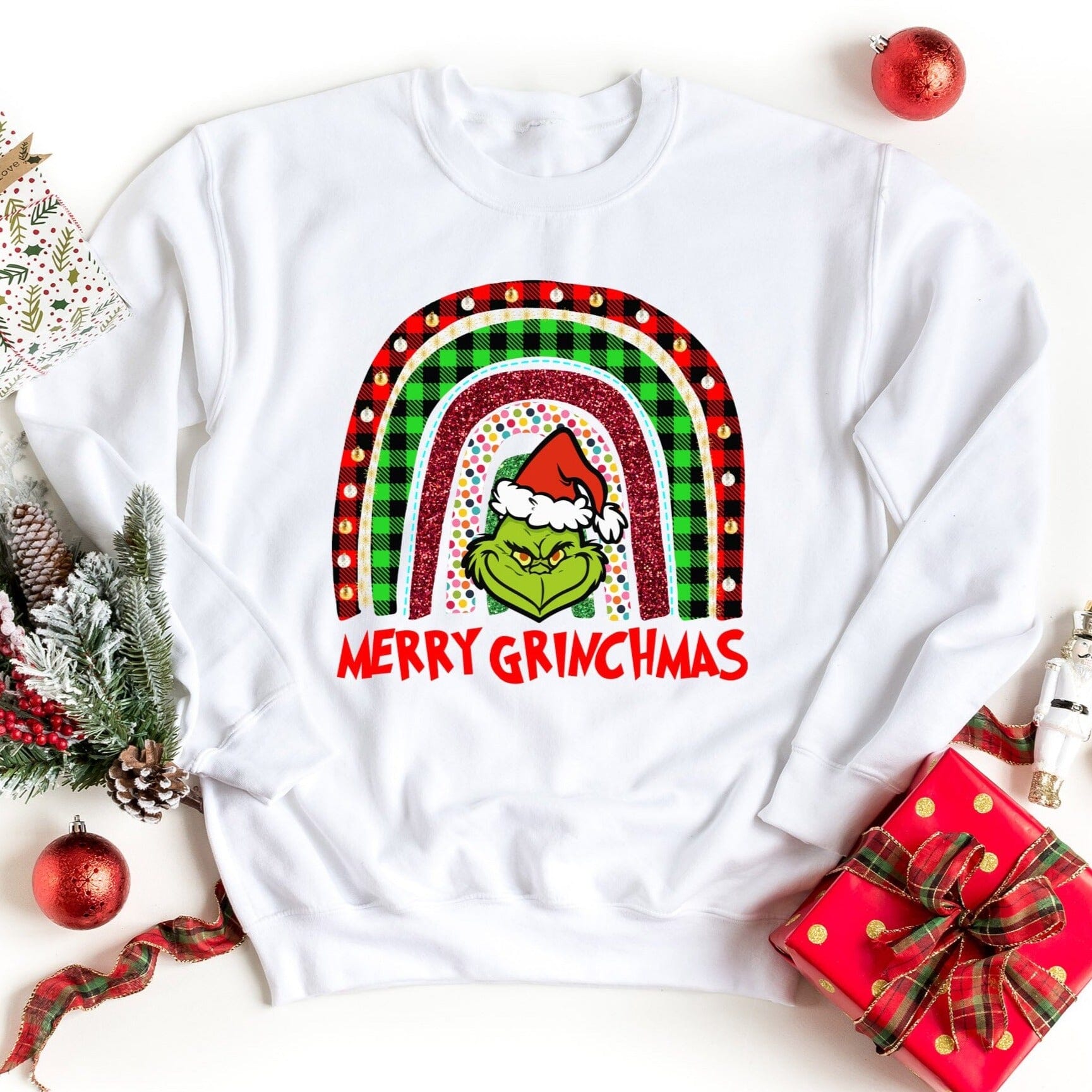 A cozy Merry Grinchmas Sweatshirt featuring festive design, perfect for holiday celebrations, made from soft cotton blend.