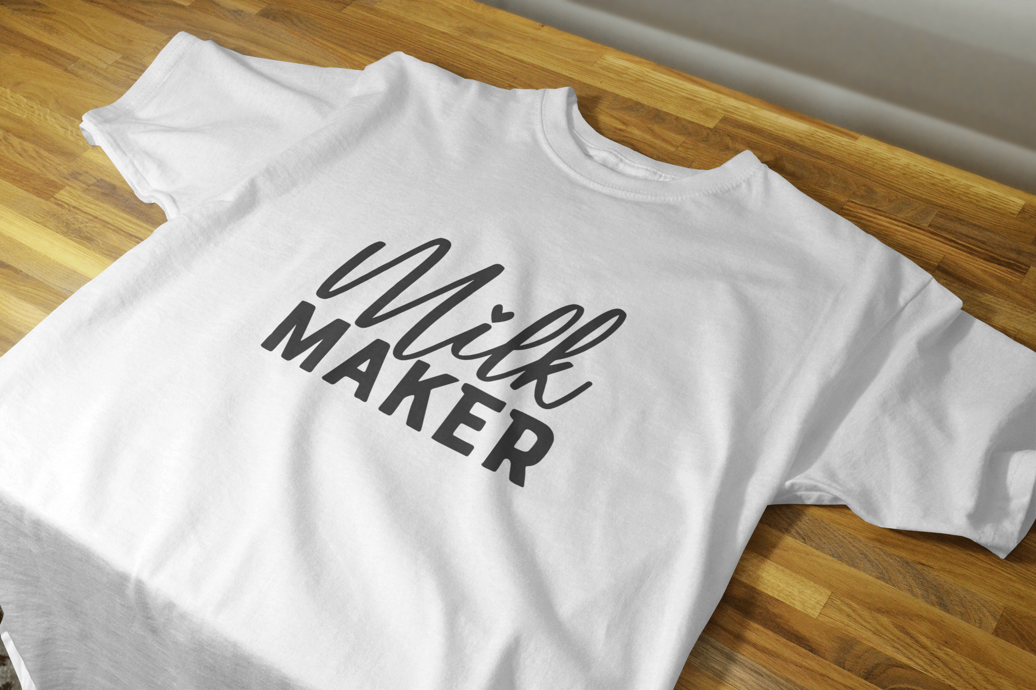 Milk Maker Shirt featuring white lettering on a black background, made from 100% preshrunk cotton.