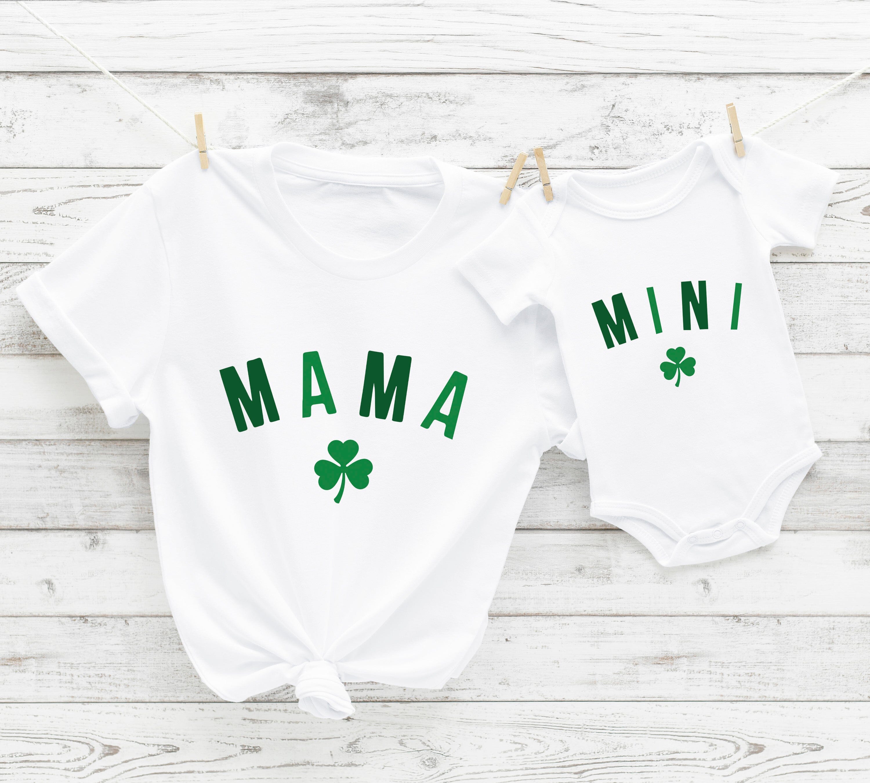 A cute Mini St. Paddy's Onesie featuring a festive design, perfect for babies celebrating St. Patrick's Day.