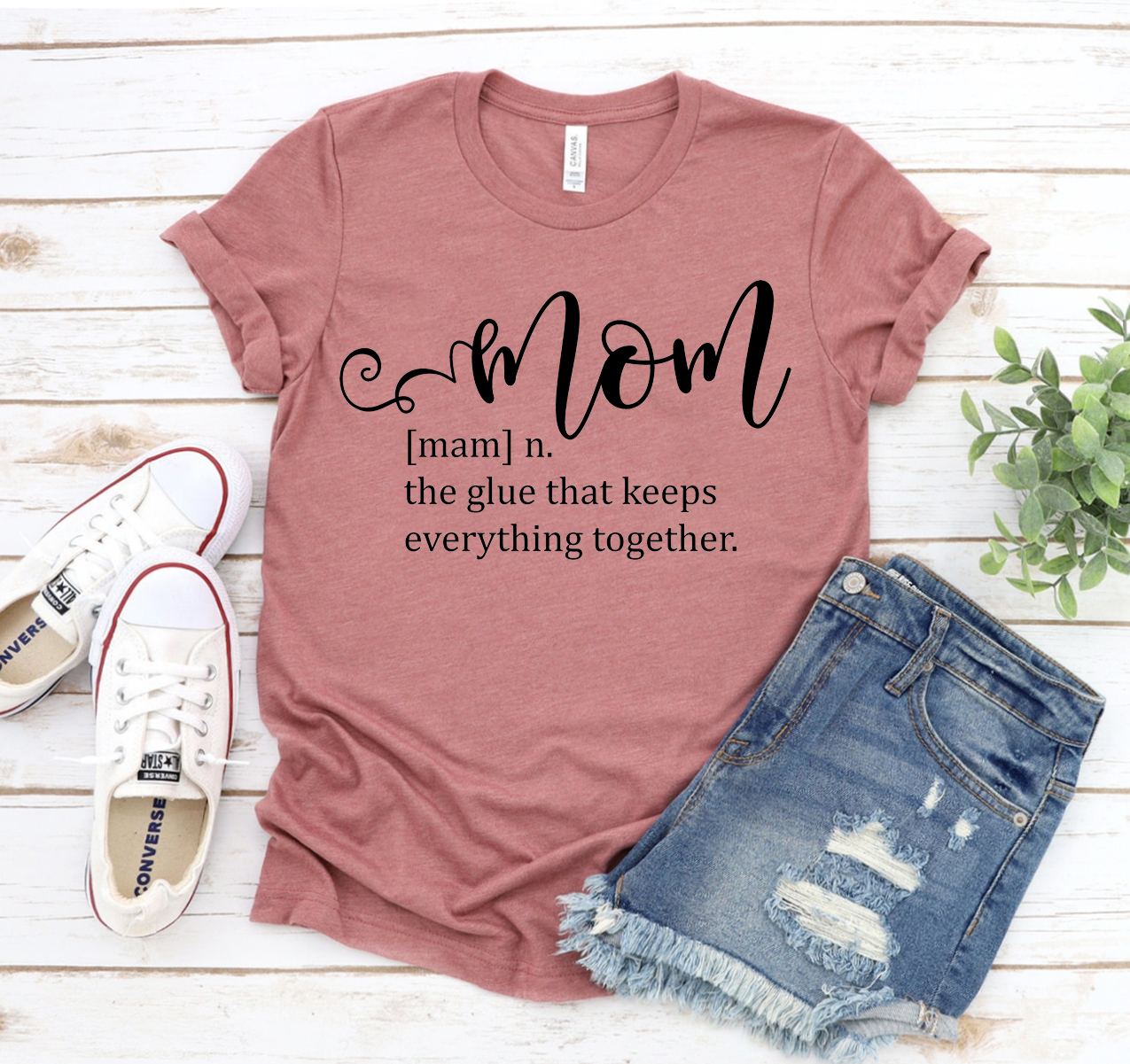 Mom Definition T-shirt in various sizes, showcasing its soft fabric and stylish design.