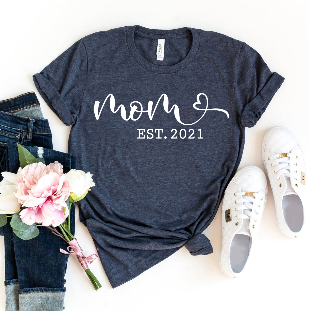 Mom Est 2021 T-shirt made of premium ring spun cotton with a stylish design and soft textile flex print.