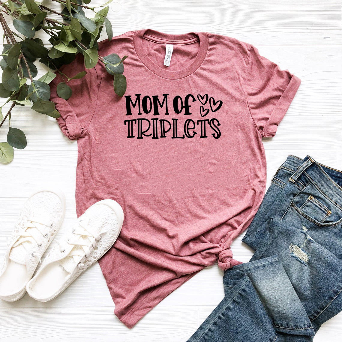 Mom Of Triplets Shirt in various colors, showcasing its soft fabric and stylish design.