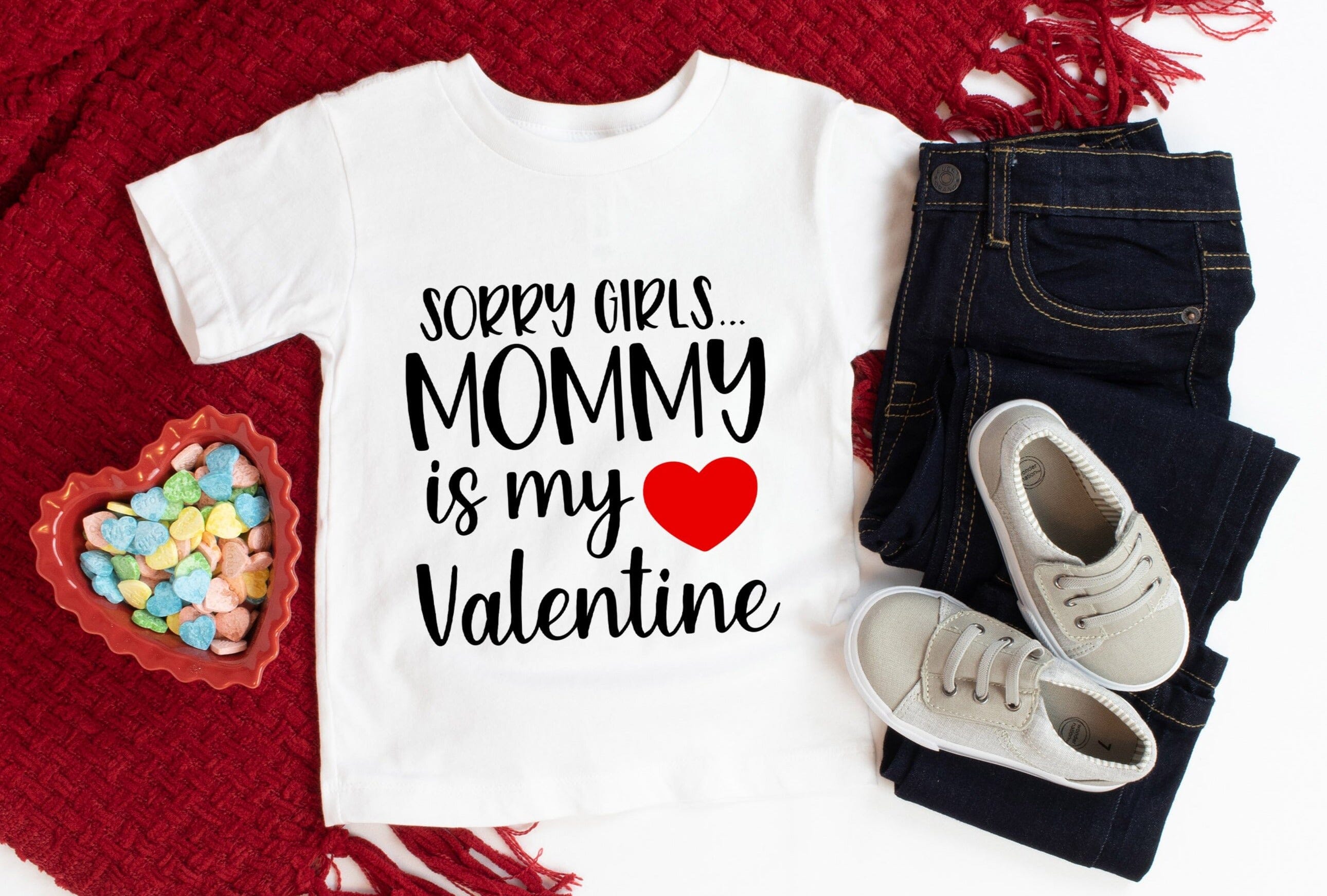 A cute baby wearing a Mommy Is My Valentine Onesie, showcasing its vibrant design and comfortable fit.