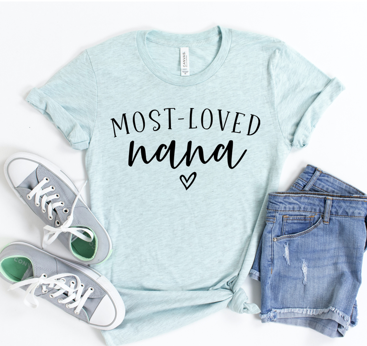 A soft, unisex Bella Canvas 3001 t-shirt featuring the phrase 'Most Loved Nana' in a stylish font, perfect for casual wear.