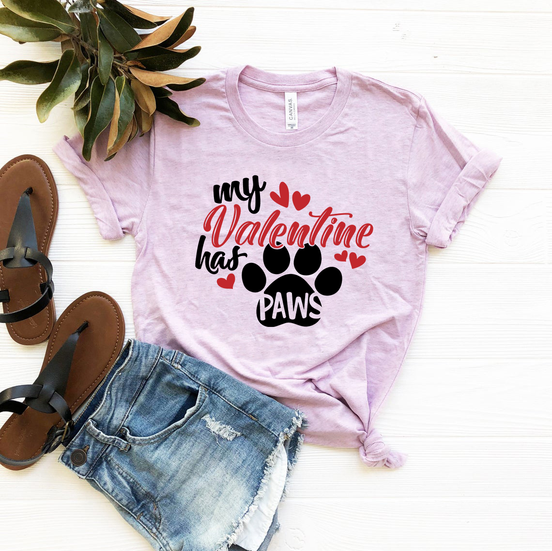 My Valentine Has Paws Shirt in various colors, showcasing a comfortable unisex design made from ring spun cotton.