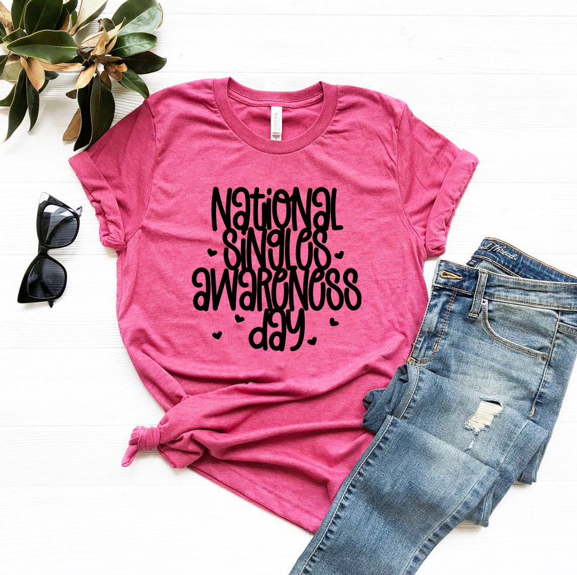 A comfortable unisex T-shirt celebrating National Singles Awareness Day, available in various colors and sizes.