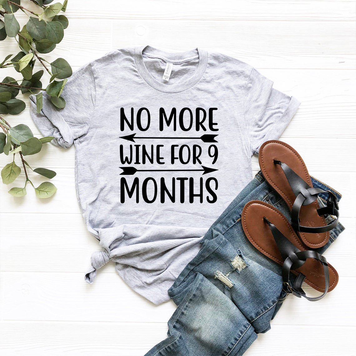 A comfortable unisex T-shirt with the phrase 'No More Wine For 9 Months' printed on it, available in various colors.