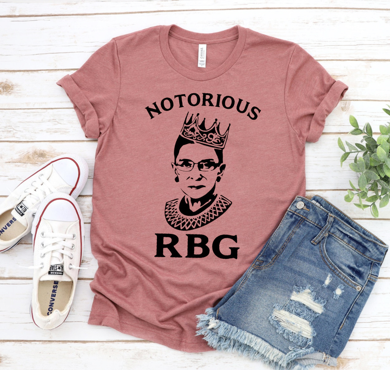 Notorious RBG Shirt featuring a classic unisex design in soft cotton fabric, available in various sizes.