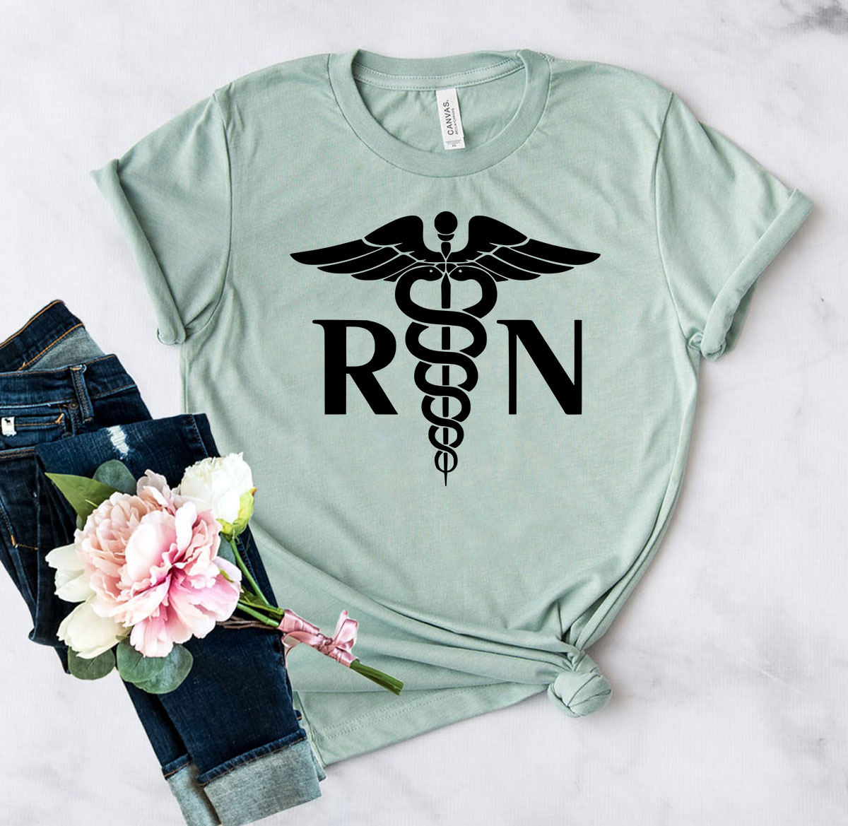 Unisex Nurse RN Shirt in various colors, showcasing soft ring spun cotton fabric and modern design.