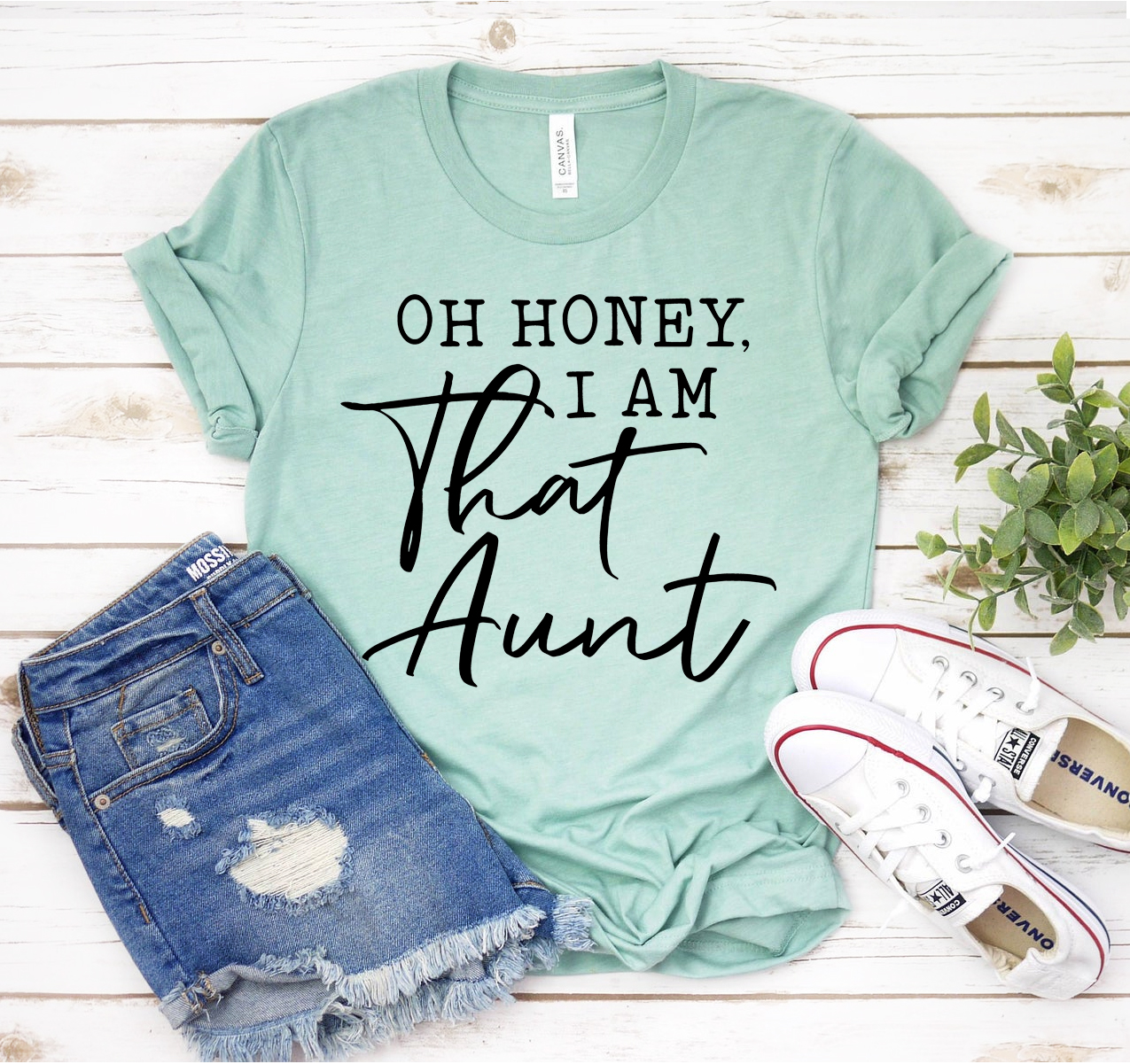 Oh Honey I Am That Aunt T-shirt displayed on a mannequin, showcasing its fun design and soft fabric.