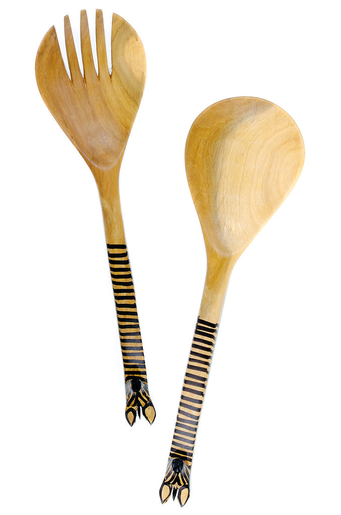 Olive wood salad spoon with a beautifully carved giraffe head, showcasing intricate details and natural wood grain.