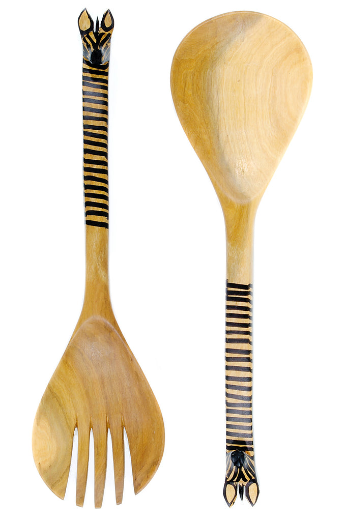 Olive wood salad spoon with a beautifully carved giraffe head, showcasing intricate details and natural wood grain.