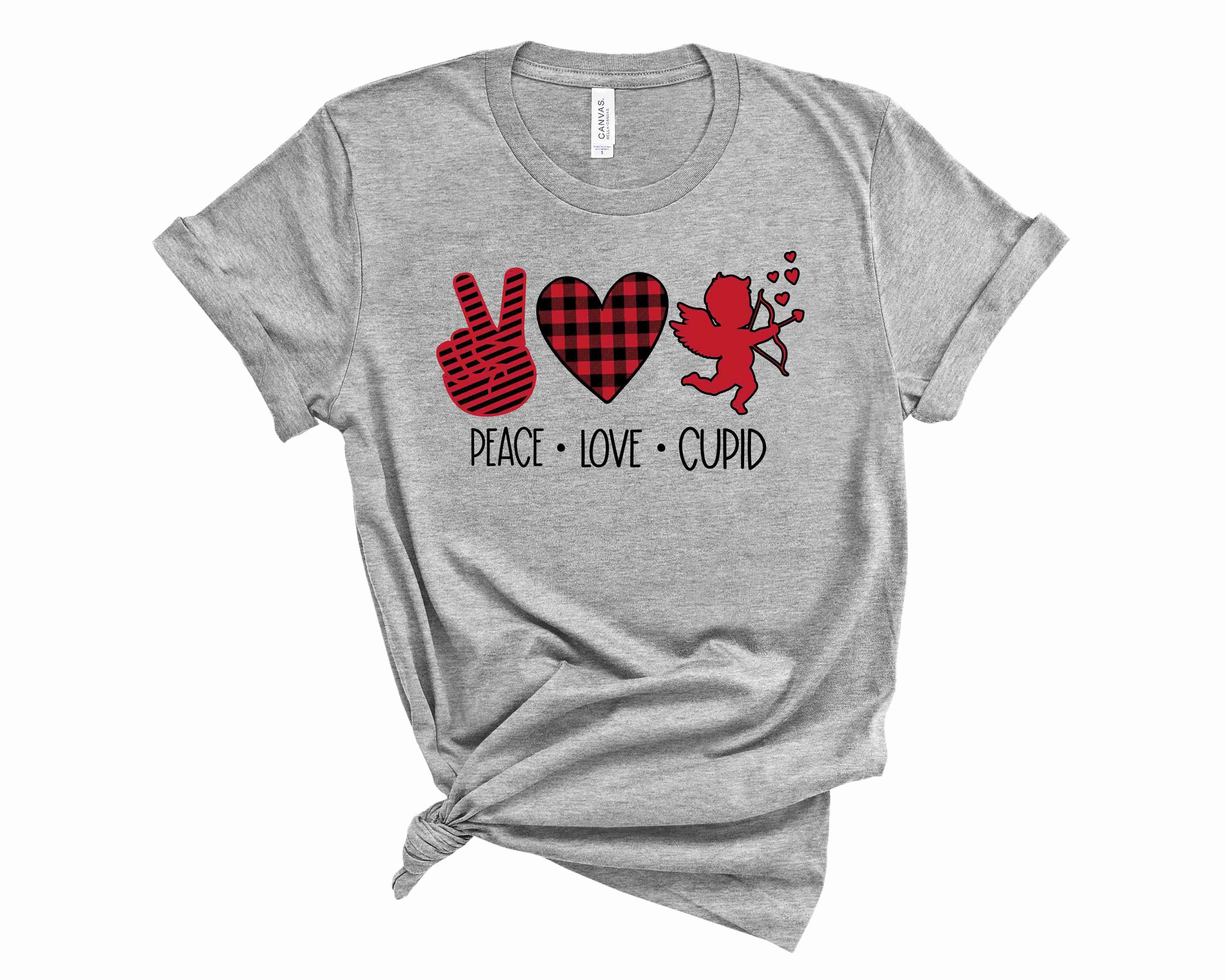 A unisex graphic tee featuring the words 'Peace Love Cupid' in vibrant colors, perfect for casual wear.